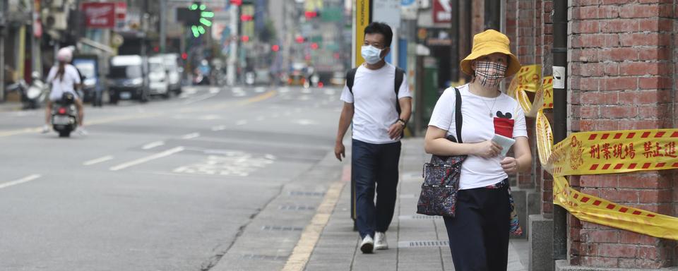 Taiwan fait face à une rare flambée des contaminations locales. [Keystone/AP - Chiang Ying-ying]