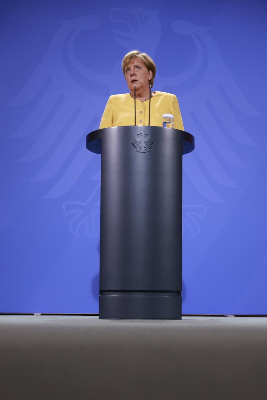 La chancelière allemande Angela Merkel s'exprime à propos de la situation en Afghanistan. Berlin, le 16 août 2021. [Keystone - Odd Andersen/AFP POOL/dpa]
