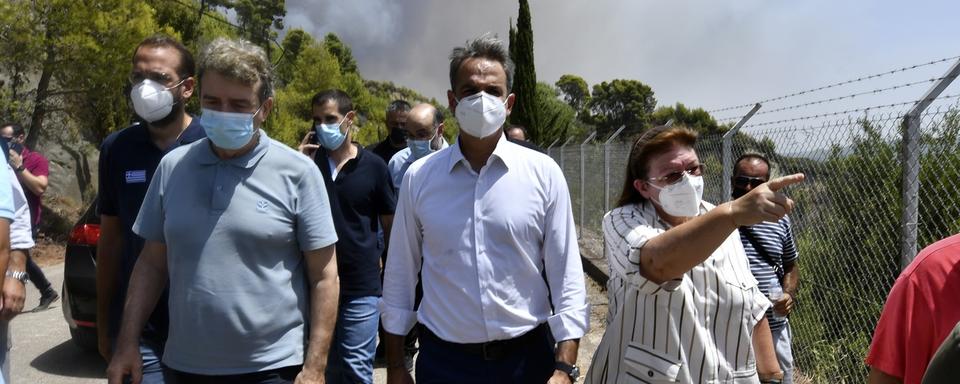 Le Premier ministre grec Kyriakos Mitsotakis est critiqué pour sa gestion des incendies. [Keystone - Giannis Spyrounis/ilialive.gr via AP]