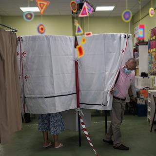 Un bureau de vote à Marseille le 20 juin 2021. [AP Photo/keystone - Daniel Cole]