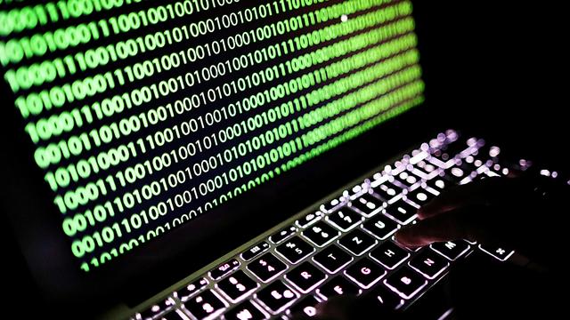 Une multitude d'entreprises menacées par une cyberattaque géante [Keystone - Oliver Berg/DPA]