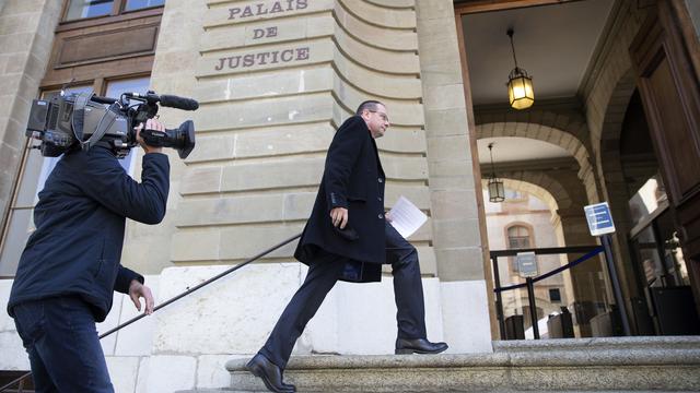 Dominique Giroud à l'entrée du Palais de justice de Genève le 19 avril 2021. [Keystone - Salvatore Di Nolfi]