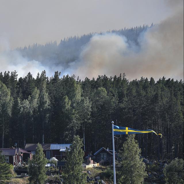 Un feu de forêt en suède en 2018. [TT via AP/Keystone - Maja Suslin]