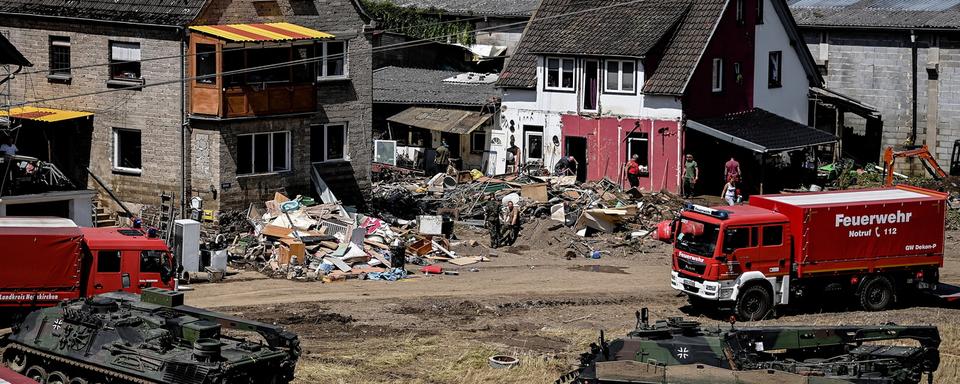 Les inondations dévastatrices dans l'ouest de l'Allemagne ont coûté la vie à au moins 165 personnes, selon un nouveau bilan lundi, alors que de nombreuses personnes sont toujours portées disparues. [KEYSTONE - SASCHA STEINBACH]