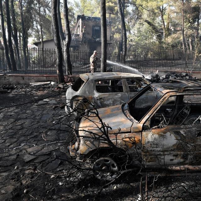 Des dégâts dûs à l'incendie, au nord d'Athènes, le 27 juillet 2021. [AFP - Louisa Gouliamaki]