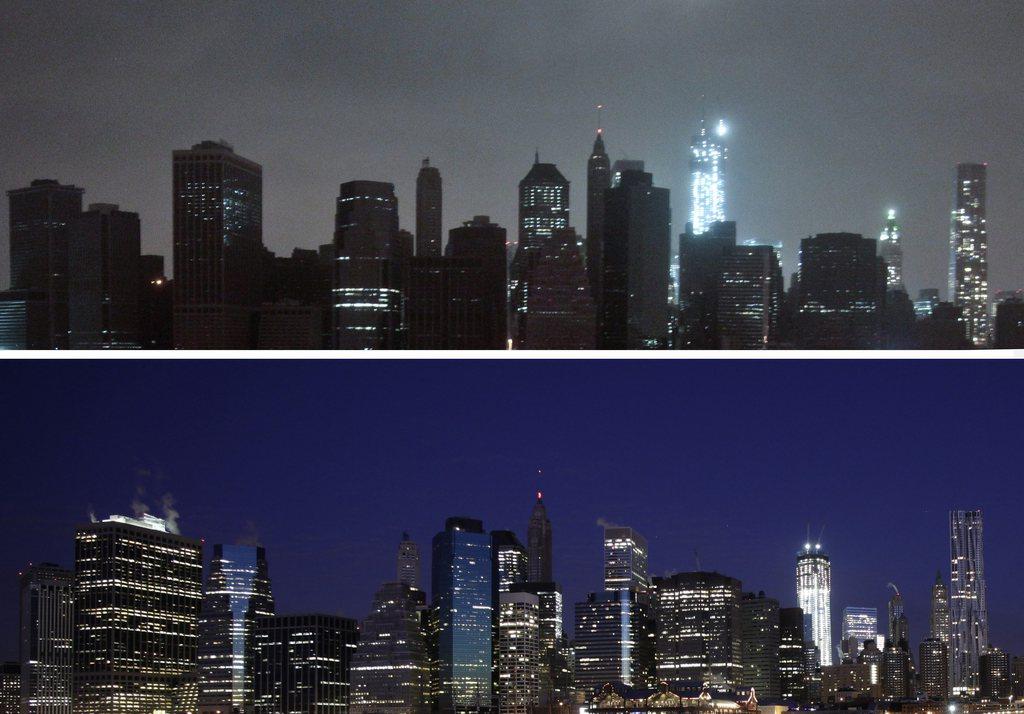 L'ouragan Sandy avait coupé l'électricité à Manhattan fin octobre 2012 (photo du haut). En comparaison, vue du même angle en janvier 2012 (en bas). [AP photo]