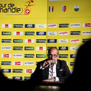 Richard Chassot, le directeur du Tour de Romandie, lors d'une conférence de presse en avril 2021 à Payerne. [Keystone - Jean-Christophe Bott]