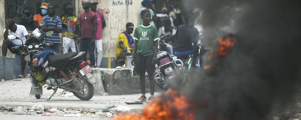 Haïti, en grande partie dominée par les gangs, est le théâtre de nombreux soulèvements de la population mécontente. [Keystone - Matias Delacroix]