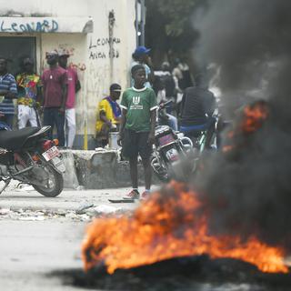 Haïti, en grande partie dominée par les gangs, est le théâtre de nombreux soulèvements de la population mécontente. [Keystone - Matias Delacroix]