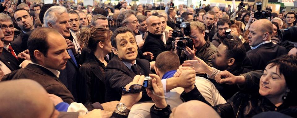 Nicolas Sarkozy au salon de l'agriculture à Paris en 2008. [AFP - Eric Feferberg]