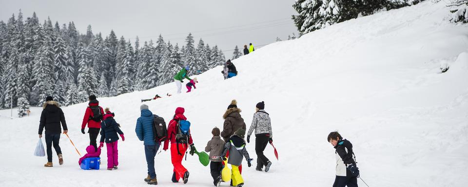 Les us et coutumes changent pour les vacances de ski. [KEYSTONE - Jean-Christophe Bott]