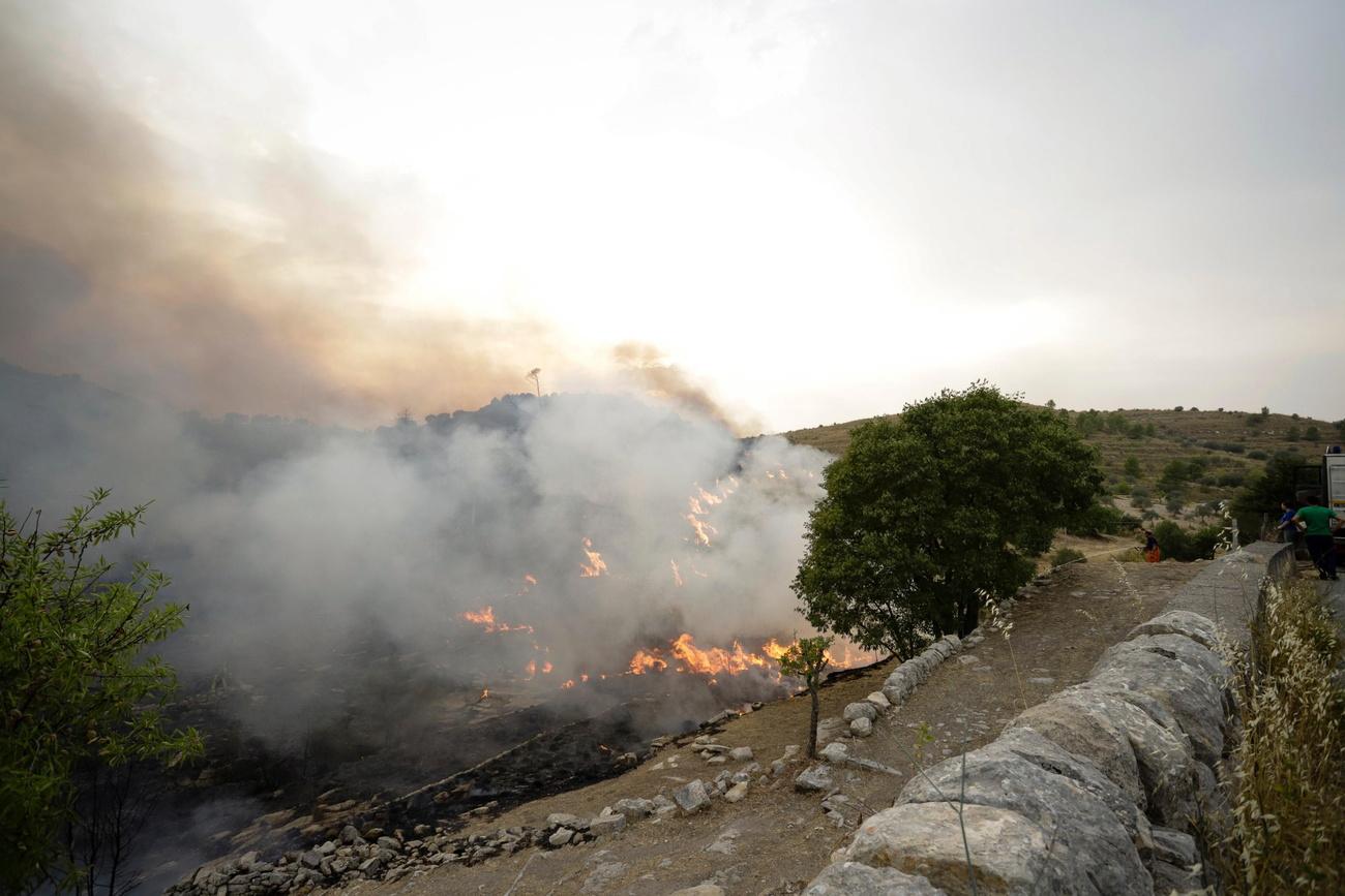 Un incendie près de Ragusa en Sicile, le 11 août 2021. [Keystone - Francesco Rute]