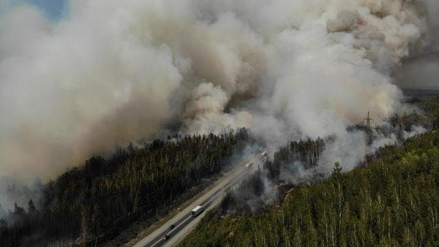 Des feux de forêt "extrêmes" sévissaient mercredi dans les régions du centre de la Russie, face à une vague de chaleur survenue après des incendies qui ont ravagé la Sibérie pendant une grande partie de l'été. [SPUTNIK VIA AFP - VLADIMIR KOTSYUBA-BELYH]