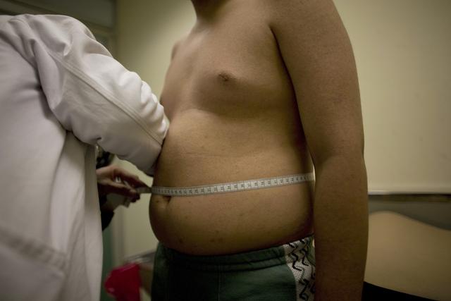 Un enfant en surpoids au Mexique. [Keystone - Alexandre Meneghini/AP]