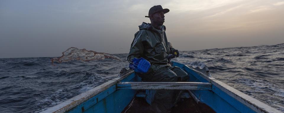 Un pêcheur sénégalais. [Keystone/EPA - Nic Bothma]