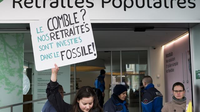 Des scientifiques soutiennent les activistes du climat qui comparaissent en justice. [KEYSTONE - Jean-Christophe Bott]