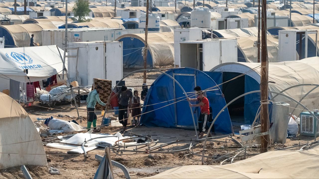 Des familles de déplacés doivent quitter leur camp en Irak. [Reuters - Charlotte Bruneau]