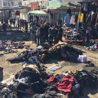 Près de 30 personnes ont été tuées jeudi par deux kamikazes qui se sont fait exploser sur un marché du centre de Bagdad. [AFP - MURTADHA AL-SUDANI]