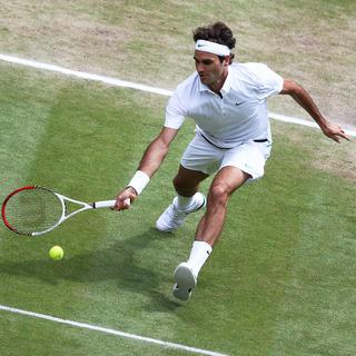 Roger Federer en 2012 lors de la Finale du Tournoi de Wimbledon. [Keystone - EPA/PAUL GILHAM / POOL]