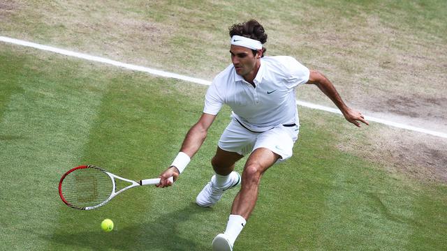 Roger Federer en 2012 lors de la Finale du Tournoi de Wimbledon. [Keystone - EPA/PAUL GILHAM / POOL]