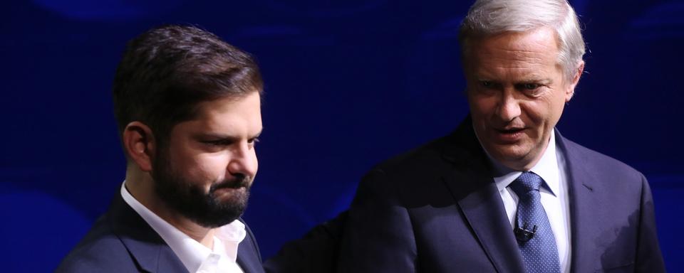 Gabriel Boric et Jose Antonio Kast, candidats à la présidentielle du Chili. [Keystone - EPA/Elvis Gonzales]