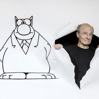 Le dessinateur belge Philippe Geluck et son fameux Chat. [AFP - Joël Saget]