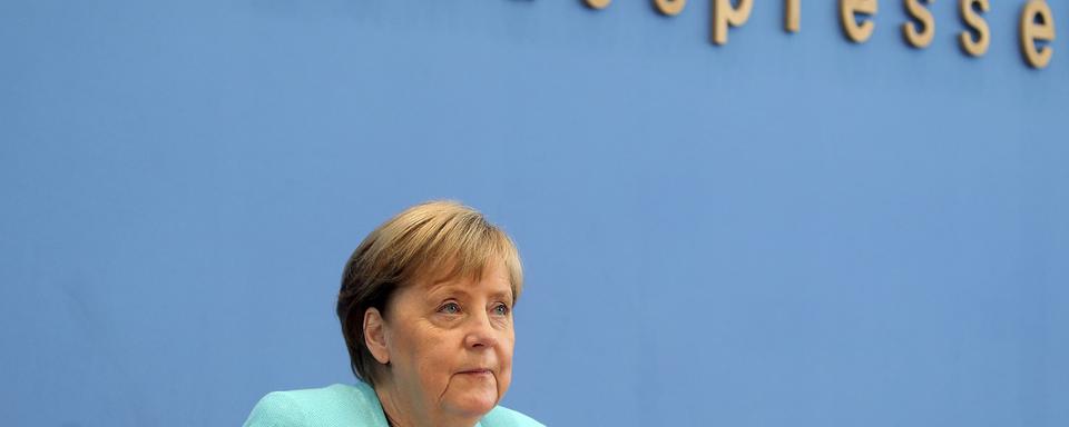 La chancelière allemande Angela Merkel a donné sa dernière conférence de presse estivale. [Keystone - AP/Wolfgang Kumm]