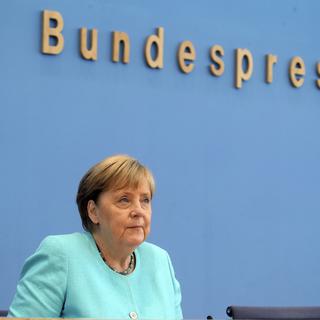 La chancelière allemande Angela Merkel a donné sa dernière conférence de presse estivale. [Keystone - AP/Wolfgang Kumm]