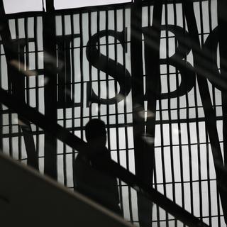 HSBC compte supprimer une centaine de postes en Suisse. [Keystone - Vincent Yu]