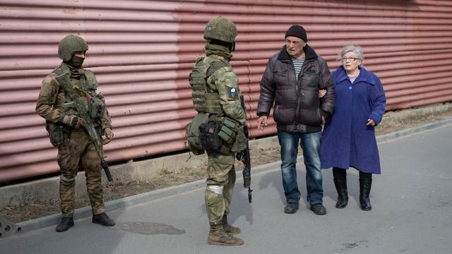 Patrouille de la Rosgvardia russe à Melitopol, en Ukraine, 29.03.2022. [Sputnik/AFP]