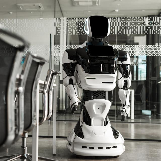 Un robot humanoïde dans une salle de conférence. [Depositphotos - VitalikRadko]