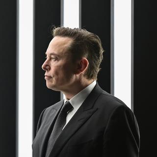 Elon Musk photographié en mars 2022 lors de l'ouverture du usine Tesla en Allemagne. [DPA/Keystone - Patrick Pleul]