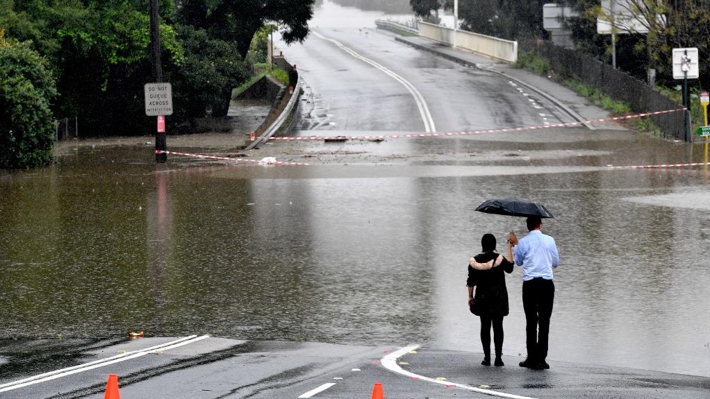 Au moins six personnes ont péri dans des inondations provoquées par des pluies diluviennes sans précédent depuis des décennies dans l'est de l'Australie. [afp - Saeed Khan]