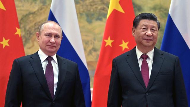 Vladimir Poutine aux côtés de Xi Jinping, l'image diplomatique forte à l'ouverture des JO de Pékin. [Keystone - Alexei Druzhinin, Sputnik, Kremlin Pool Photo via AP]