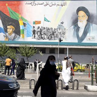 Un panneau dans la rue à Téhéran avec des portraits de l'ayatollah Ali Khamenei. [AFP - Atta Kenare]