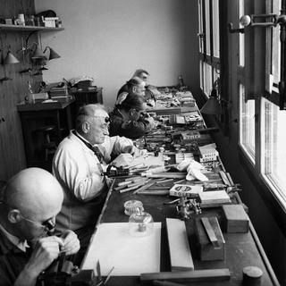 Des fabricants de montres chez Rolex, à Genève, en 1940. [Keystone - photopress-archiv]