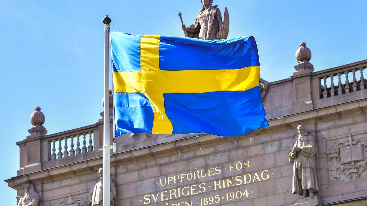 Le drapeau suèdois devant le Parlement à Stockholm. [AFP - Jonas Ekstromer]