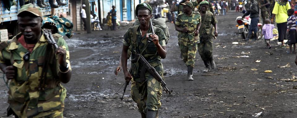 Les rebelles du M23 sont accusés d'avoir commis un "massacre" dans l'est de la RDC avec le soutien du Rwanda, qui dément. [Keystone - Jerome Delay]