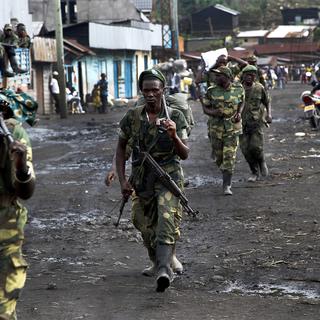 Les rebelles du M23 sont accusés d'avoir commis un "massacre" dans l'est de la RDC avec le soutien du Rwanda, qui dément. [Keystone - Jerome Delay]