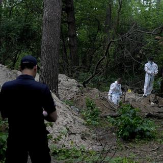 La commission de l'ONU sur l'Ukraine a recueilli de multiples allégations sur de possibles crimes de guerre. [Keystone - AP Photo/Natacha Pisarenko]