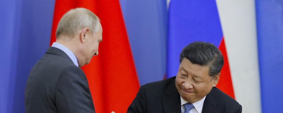 Vladimir Poutine et Xi Jinping à Saint-Pétersbourg en juin 2019. [Pool/AP/Keystone - Dmitri Lovetsky]