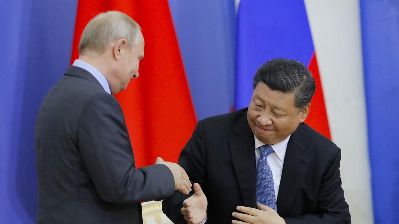 Vladimir Poutine et Xi Jinping à Saint-Pétersbourg en juin 2019. [Pool/AP/Keystone - Dmitri Lovetsky]