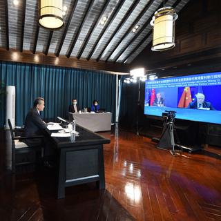 Le Ministre chinois des affaires étrangères en vidéo conférence avec son homologue européen Josep Borell, le 29 mars 2022. [Xinhua - Zhou Mu - AFP]