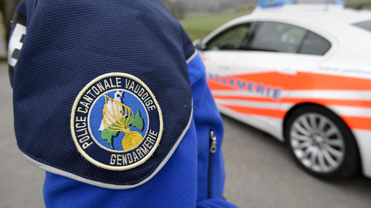 Police vaudoise avec voiture. [Keystone - Laurent Gillieron]