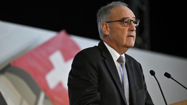 Le conseiller fédéral Guy Parmelin à l'assemblée des délégués de l'UDC, le 9 avril 2022 à Coire (GR). [Keystone - Gian Ehrenzeller]