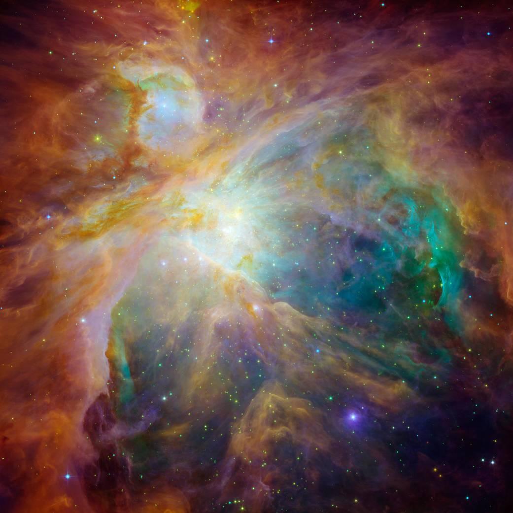 Image composite – en infrarouge et lumière visible – de la nébuleuse d'Orion, une pépinière d'étoiles avec ses tourbillons d'hydrogène, de soufre, de carbone et d'hydrocarbures. [Spitzer/Hubble/NASA - Andres Almeida/JPL-Caltech STScI]