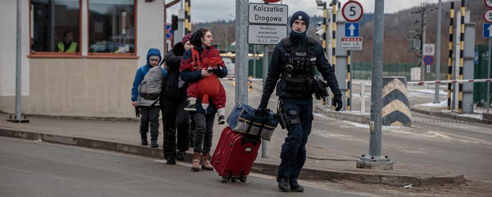 Réfugiés pris en charge côté polonais de la frontière à Kroscienko (image d'illustration). [NurPhoto via AFP - Enrico Mattia Del Punta]