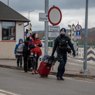 Réfugiés pris en charge côté polonais de la frontière à Kroscienko (image d'illustration). [NurPhoto via AFP - Enrico Mattia Del Punta]