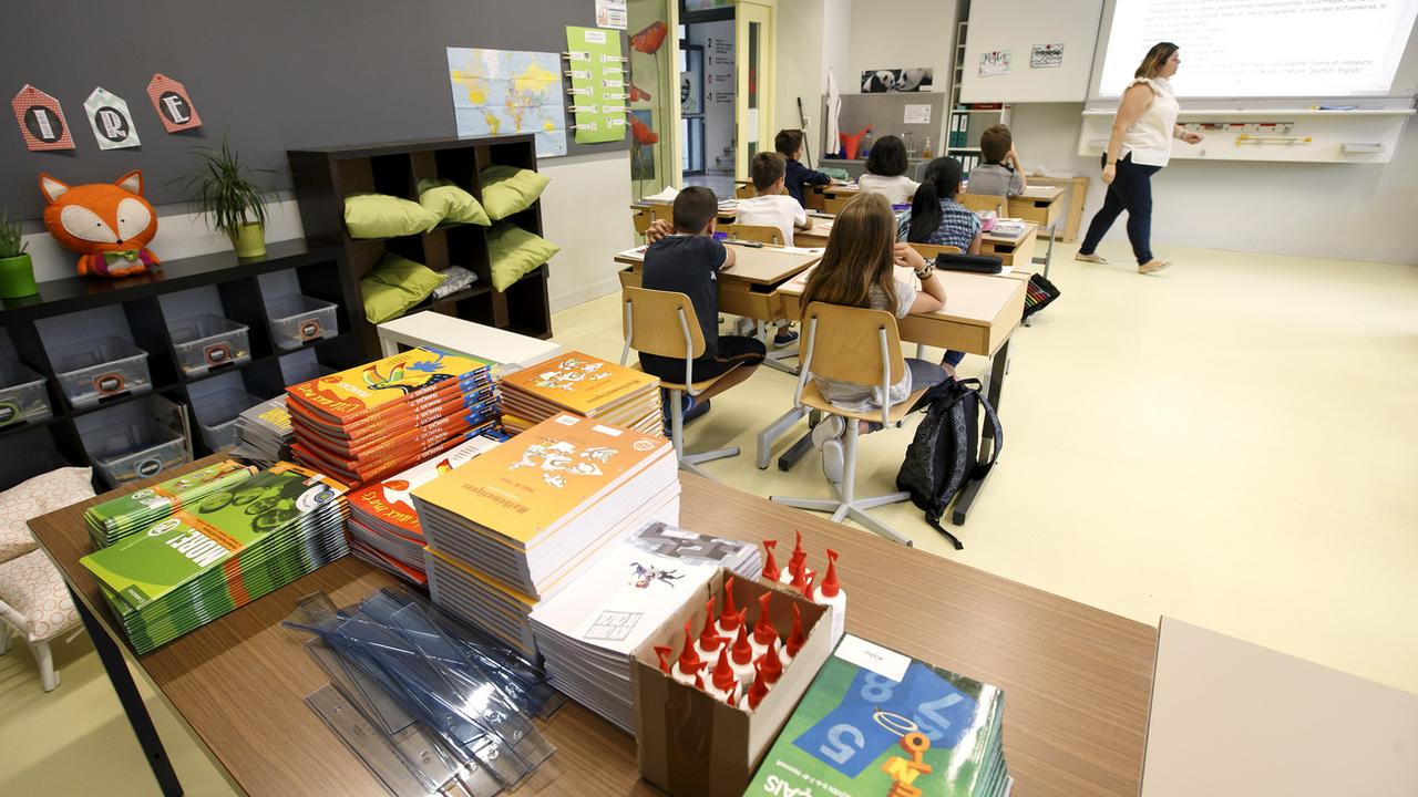 A Genève, la croissance des effectifs scolaires se poursuit avec plus de 80'000 élèves qui vont reprendre le chemin de l'école lundi. [Keystone - Salvatore Di Nolfi]