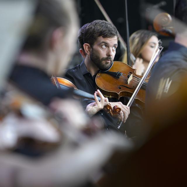 Les musiciens du Sinfonietta de Lausanne sur la scène du 41e Paléo Festival à Nyon le 24 juillet 2016. [Keystone - Anthony Anex]